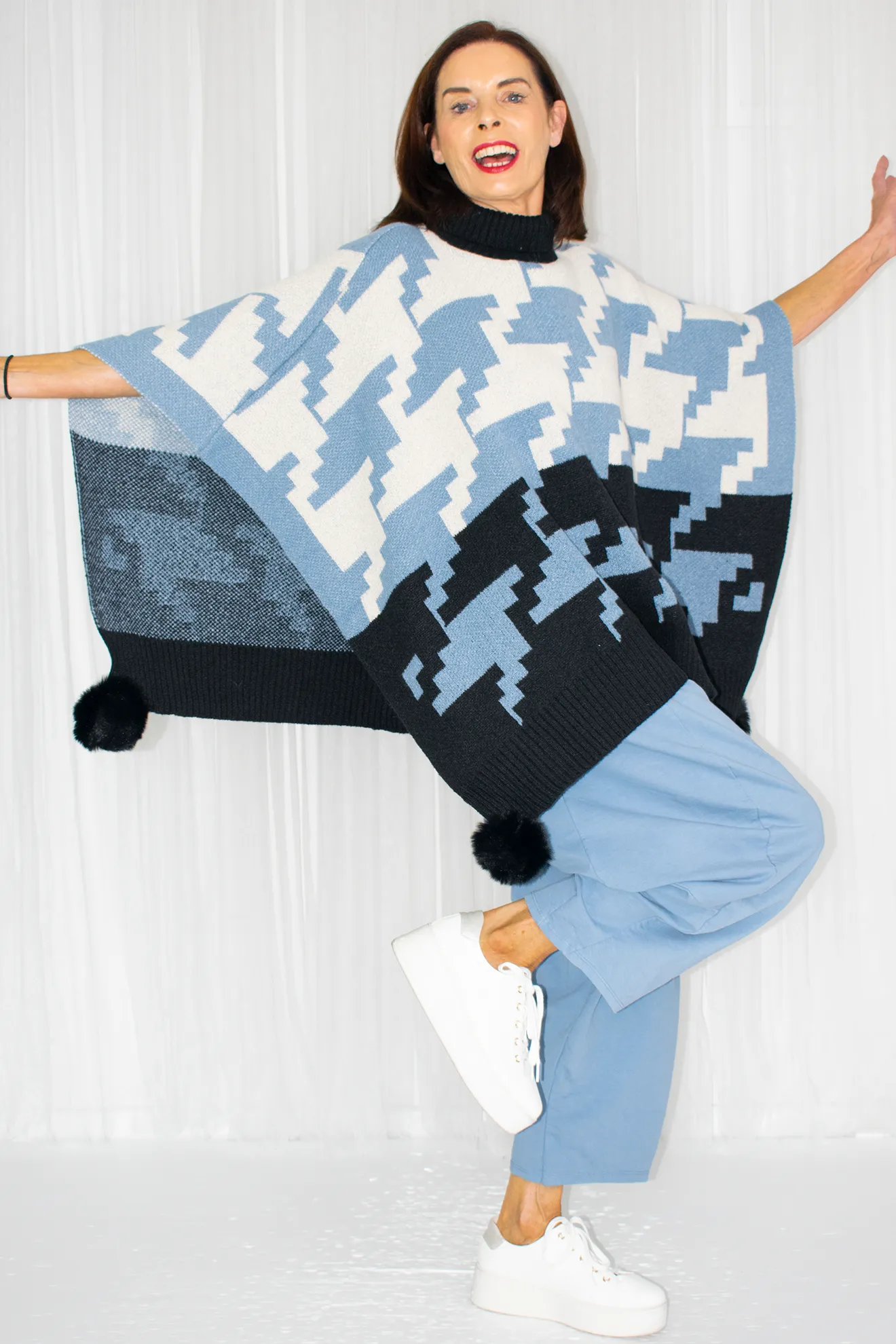 Penny Pom Pom Geometric Poncho Style Jumper in Baby Blue